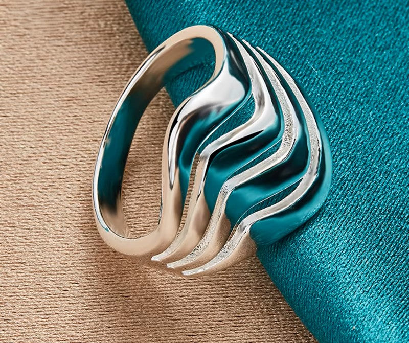 A delicate silver ring featuring a minimalist design, perfect for everyday elegance
