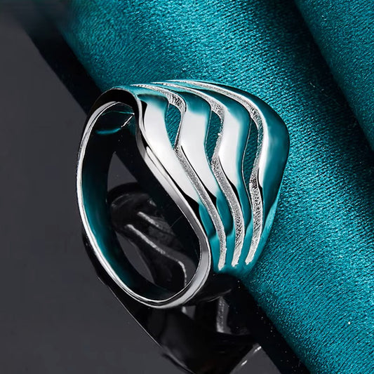 A delicate silver ring featuring a minimalist design, perfect for everyday elegance